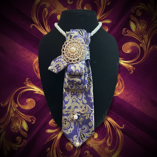 Strength In Her ornate brooch necktie accessory in deep purple with gold damask pattern, crystal and pearl embellishments.